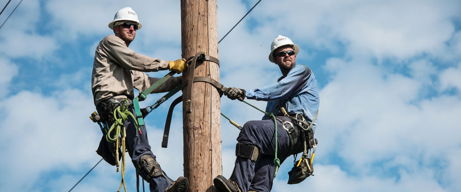 Two Linemen on a pole